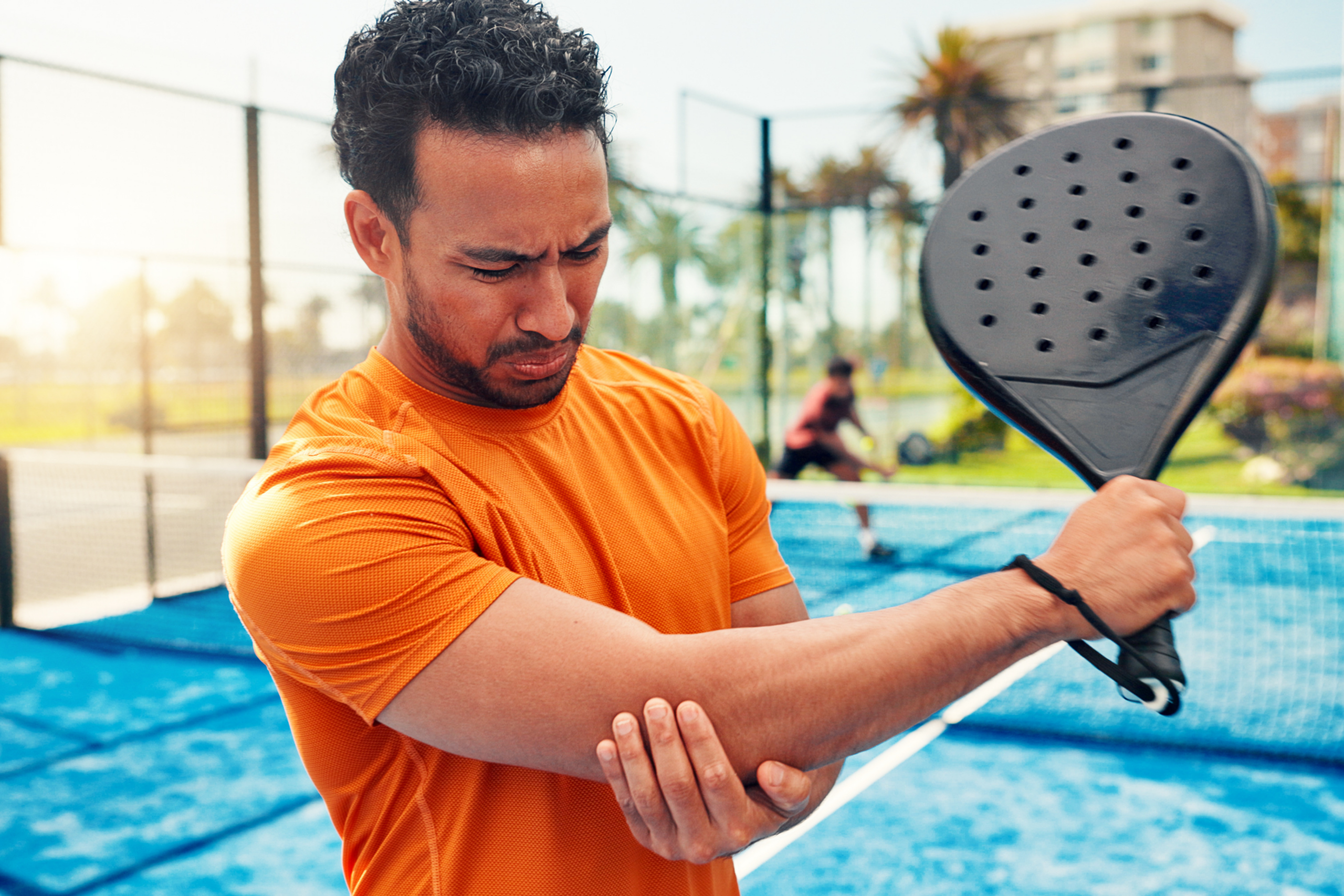 man with arm injury playing sports